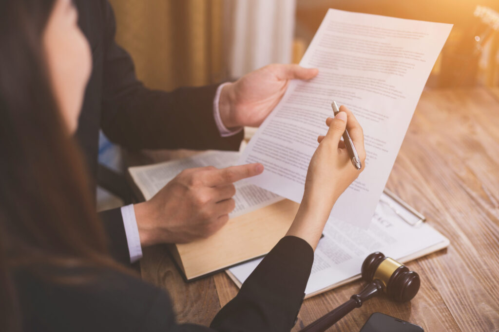 Legal professional discussing negligence claims with a client.